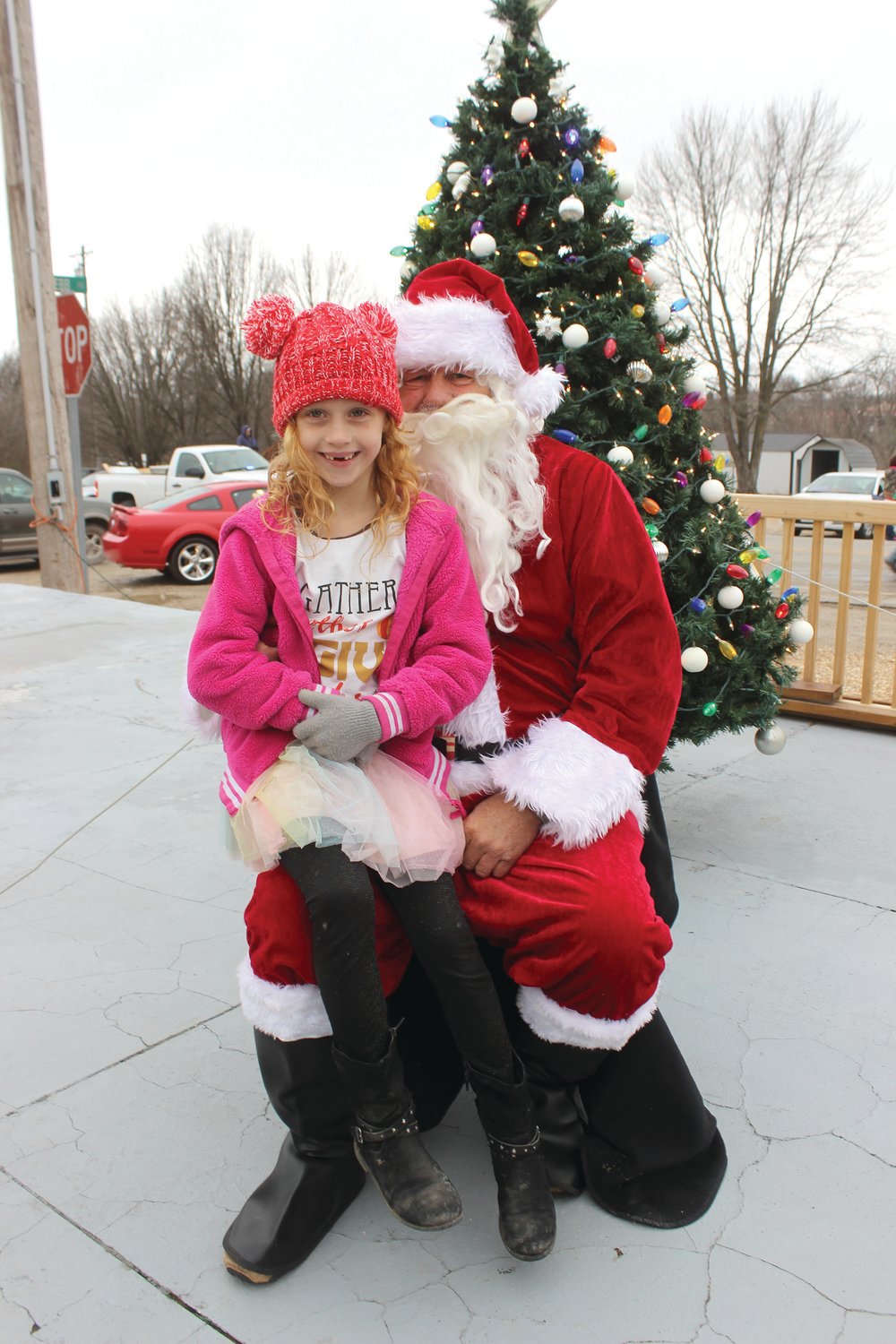 Kyley Burns, 7, of Grovespring, after telling Santa Claus what she wants for Christmas this year.